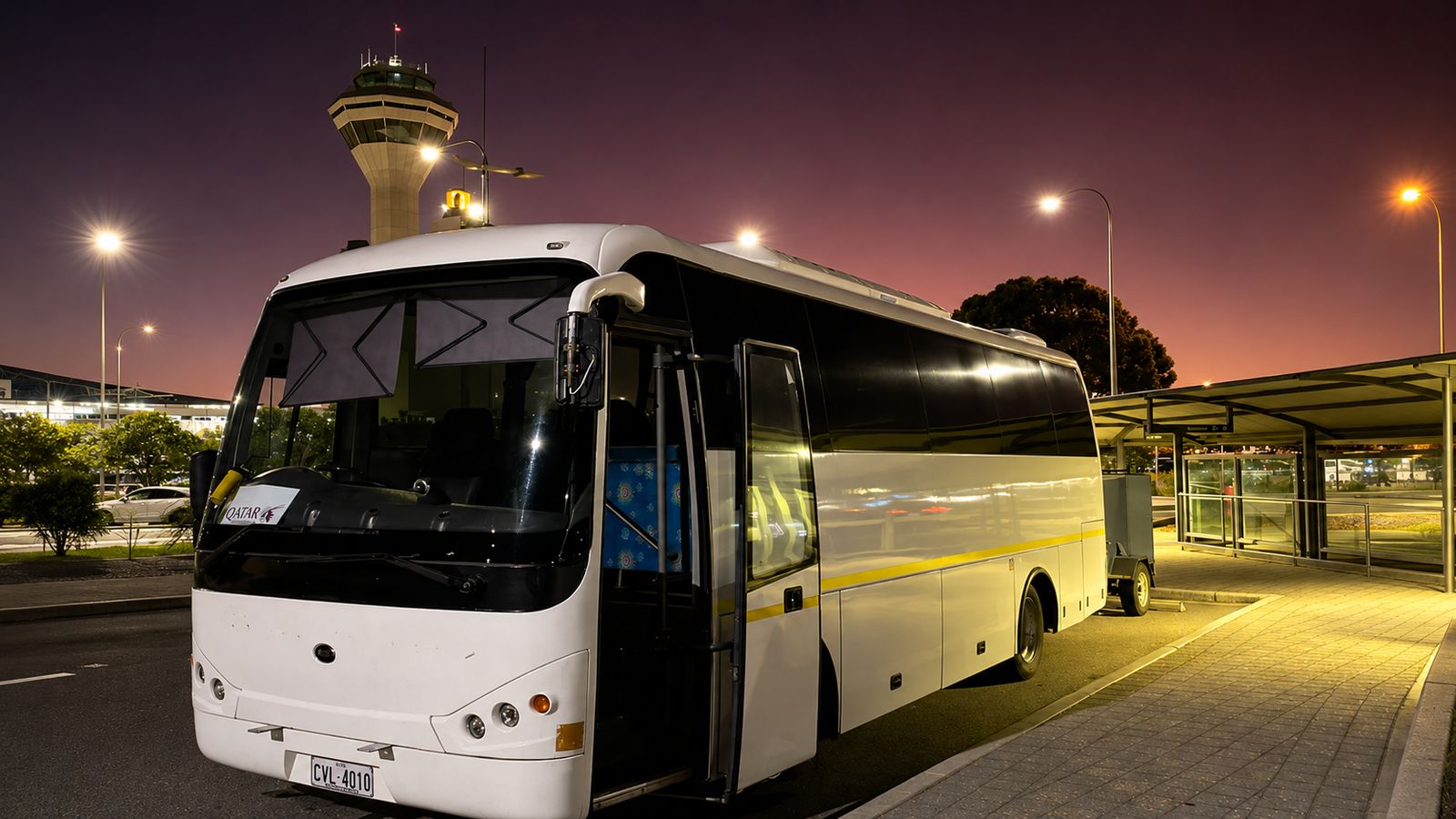 Coach at the airport at dusk